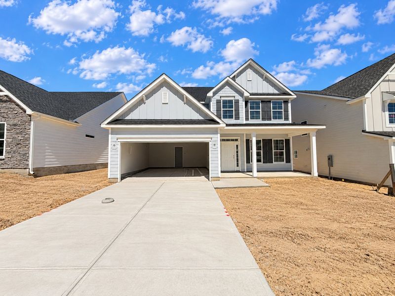 Front exterior of a new home in Arbordale, Elgin, SC, highlighting curb appeal (Image 1). Front exterior of a new home in Arbordale, Elgin, SC, highlighting curb appeal (Image 1).