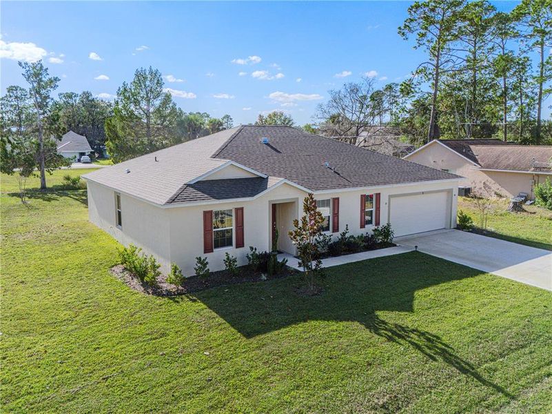 Front exterior of a new home in Palm Coast, Palm Coast, FL, highlighting curb appeal (Image 22). Front exterior of a new home in Palm Coast, Palm Coast, FL, highlighting curb appeal (Image 22).