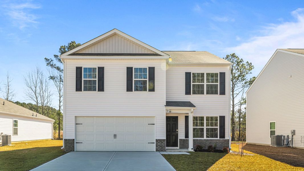 Representative exterior photo of a completed home built from the BELHAVEN by D.R. Horton in Madeline Farm, New Bern, NC (Image 1).