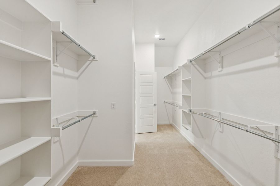 Primary Closet in the Da Vinci II home plan by Trophy Signature Homes – REPRESENTATIVE PHOTO Primary Closet in the Da Vinci II home plan by Trophy Signature Homes – REPRESENTATIVE PHOTO