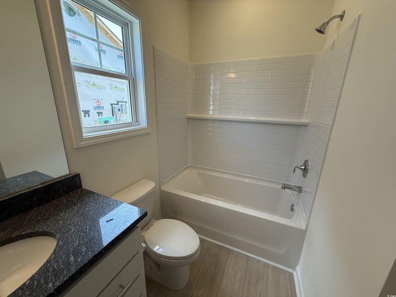 Carpeted empty room with baseboards Carpeted empty room with baseboards