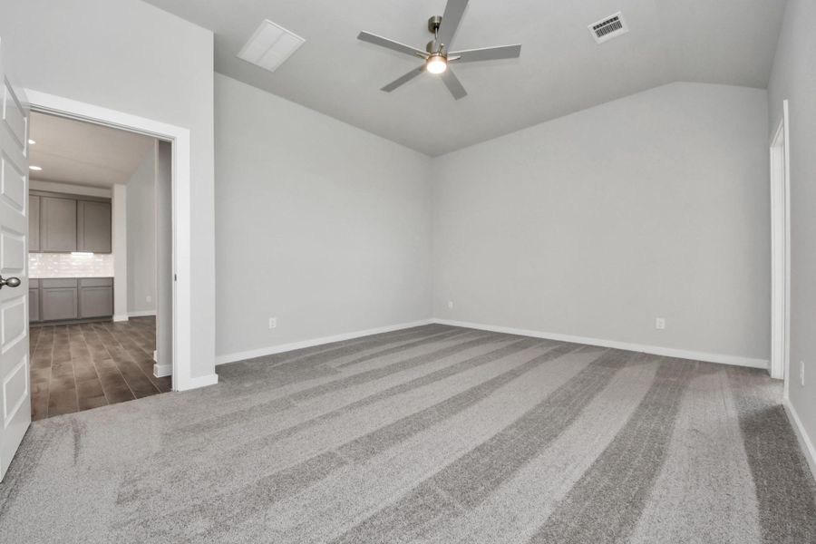 Come and unwind after a long day in this magnificent primary suite! This spacious room features plush carpet, warm paint, high ceilings and large windows with privacy blinds. Come and unwind after a long day in this magnificent primary suite! This spacious room features plush carpet, warm paint, high ceilings and large windows with privacy blinds.