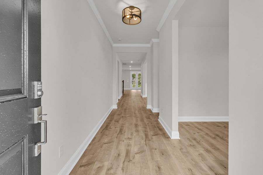 Spacious, unfurnished interior of a new home in Tidewater at Lakes of Cane Bay, Summerville (Image 18).