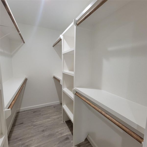RIGHT SIDE: PRIMARY BEDROOM WALK-IN CLOSET