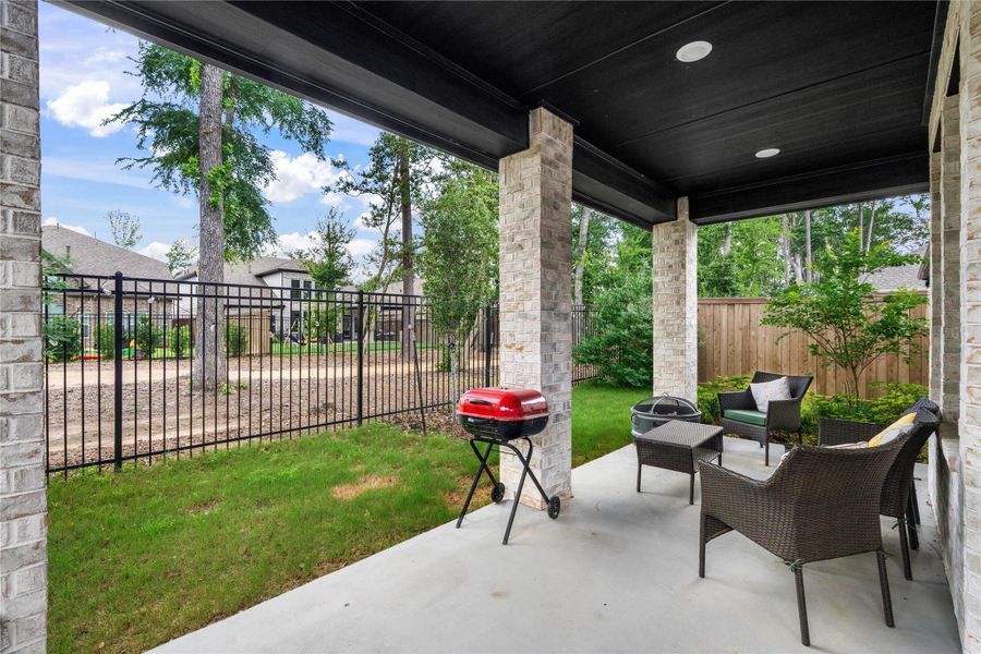 a cozy covered patio offering a private and serene outdoor space. a cozy covered patio offering a private and serene outdoor space.