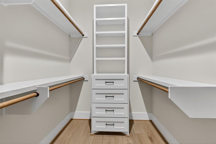 Walk in closet with custom built-in dresser!
