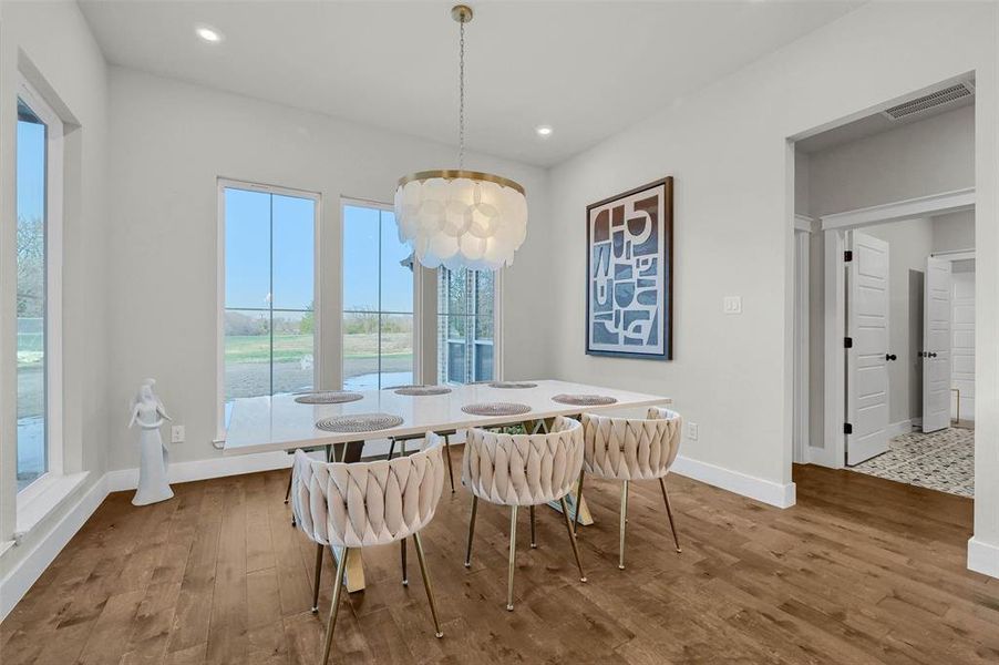 Dining area with hardwood / wood-style flooring