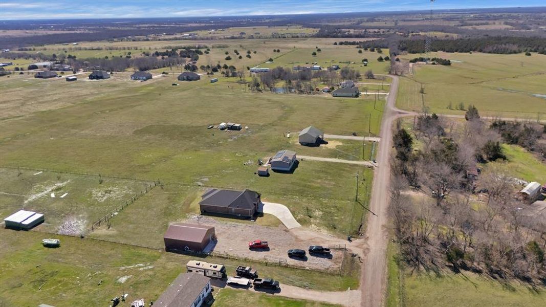 Birds eye view of property featuring a rural view