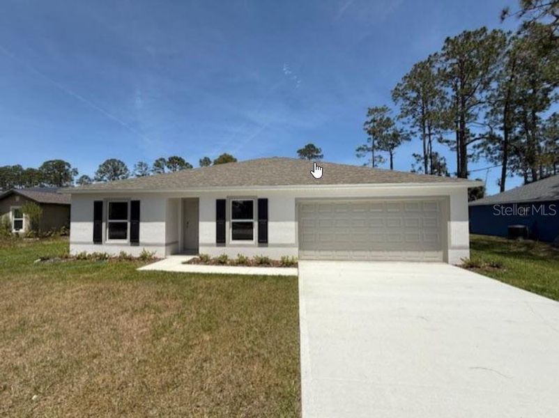 Front exterior of a new home in Palm Coast: Value Collection, Palm Coast, FL, highlighting curb appeal (Image 2).