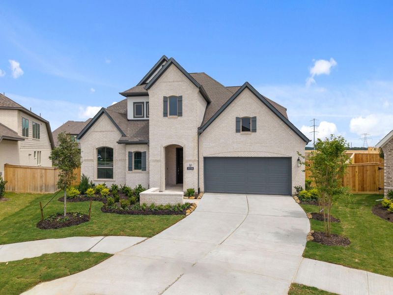 Front exterior of a new home in Bridgeland, Cypress, TX, highlighting curb appeal (Image 21).