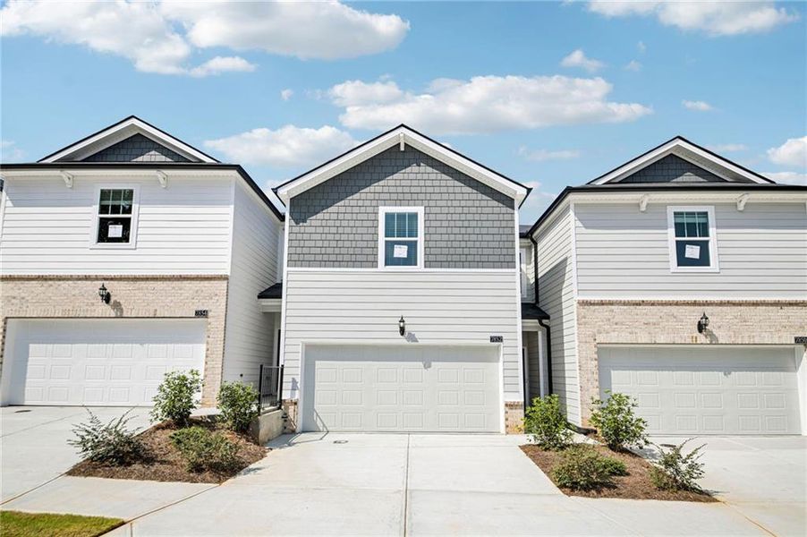 Front exterior of a new home in Artisan Walk, Fairburn, GA, highlighting curb appeal (Image 25).