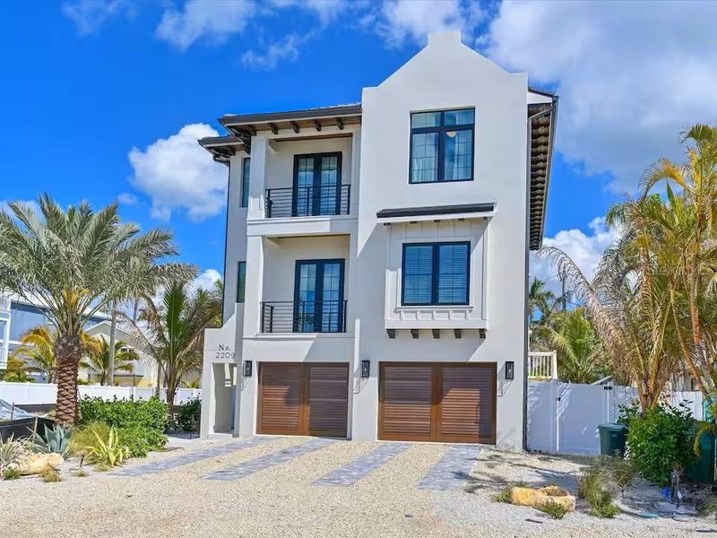 Front exterior of a new home in , Bradenton Beach, FL, highlighting curb appeal (Image 22).