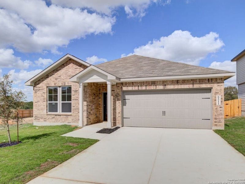 Front exterior of a new home in Royal Crest, San Antonio, TX, highlighting curb appeal (Image 17).