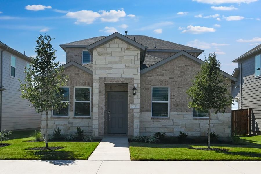 Front exterior of a new home in Emory Crossing 40s, Hutto, TX, highlighting curb appeal (Image 1). Front exterior of a new home in Emory Crossing 40s, Hutto, TX, highlighting curb appeal (Image 1).