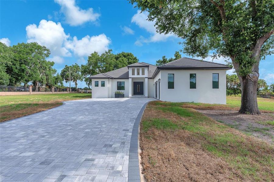Front exterior of a new home in , Thonotosassa, FL, highlighting curb appeal (Image 26).