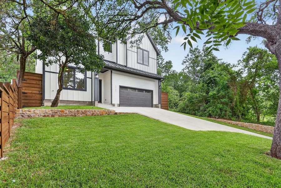 Front exterior of a new home in , Dallas, TX, highlighting curb appeal (Image 24).