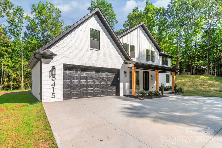 Front exterior of a new home in , Waxhaw, NC, highlighting curb appeal (Image 23). Front exterior of a new home in , Waxhaw, NC, highlighting curb appeal (Image 23).