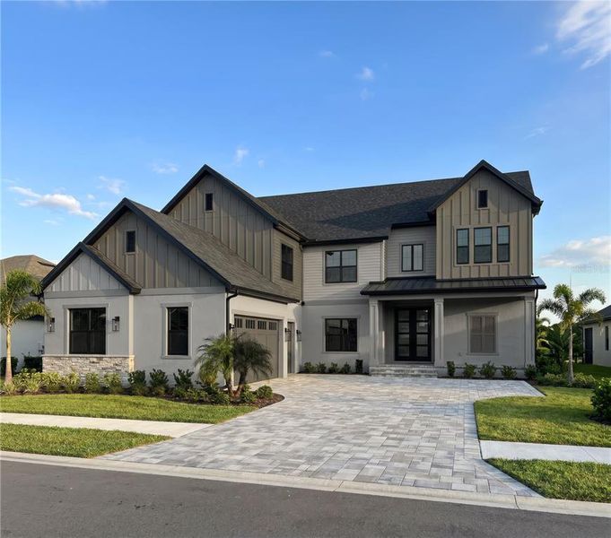 Front exterior of a new home in , Winter Garden, FL, highlighting curb appeal (Image 1). Front exterior of a new home in , Winter Garden, FL, highlighting curb appeal (Image 1).