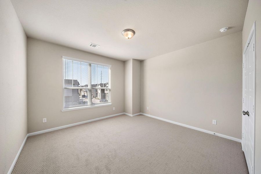 Large windows fill the space with natural light, providing a bright and welcoming atmosphere.