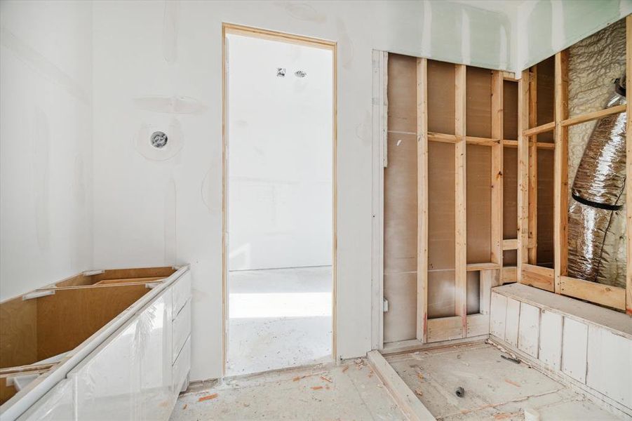 Custom Benedettini cabinetry has been installed in the en-suite bathroom vanity of the secondary bedroom, elevating both style and functionality in the space. The final touch awaits with the upcoming installation of a frameless glass enclosure for the walk-in shower, promising a modern and sophisticated finish to the bathroom design.