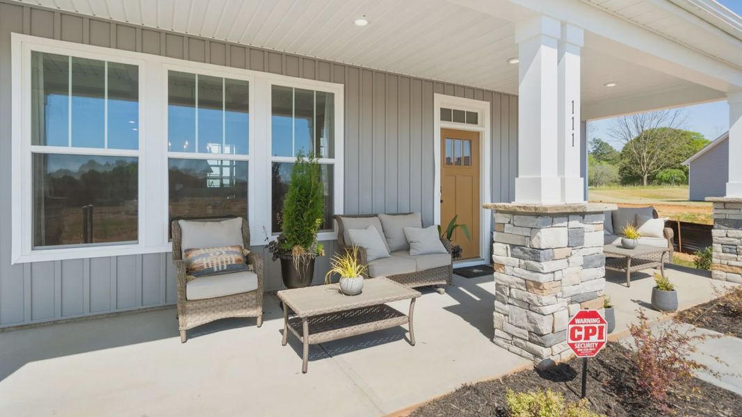Classic-meets-modern exterior with a covered entry and thoughtful craftsmanship at Benjamin's Grove