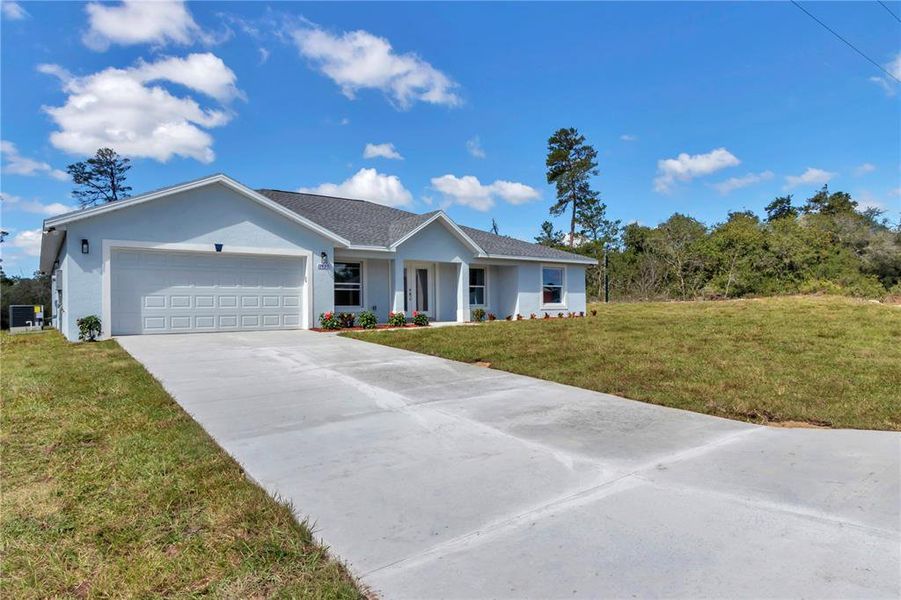 Front exterior of a new home in , Ocala, FL, highlighting curb appeal (Image 22).