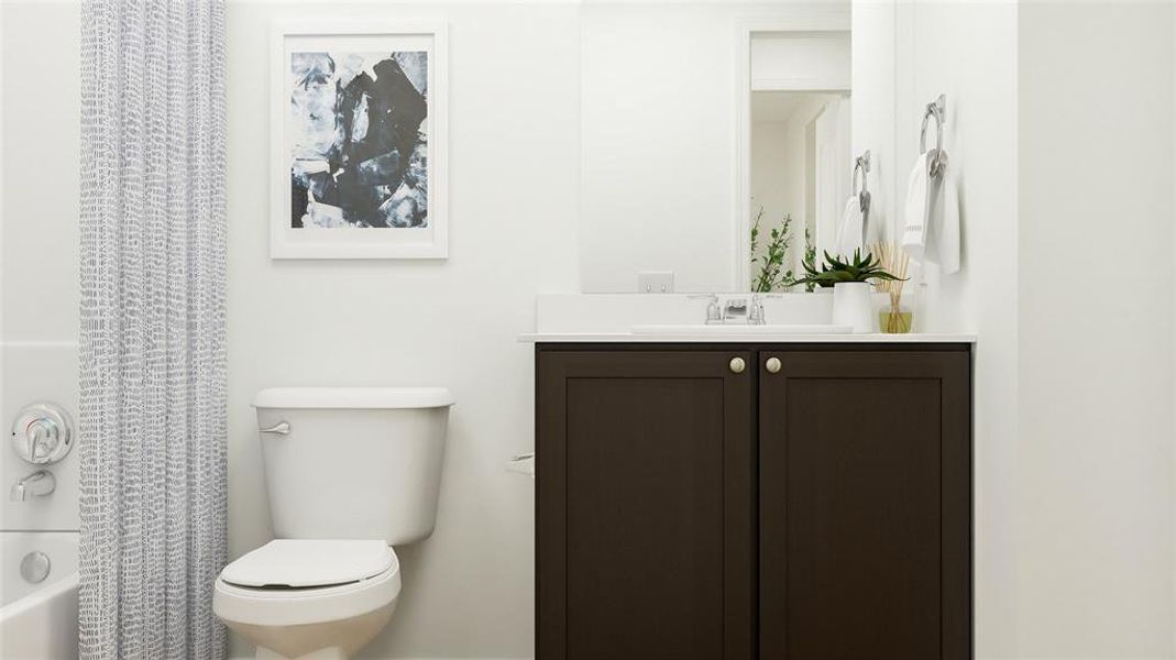 Full bathroom featuring shower / tub combo with curtain, oversized vanity, and toilet