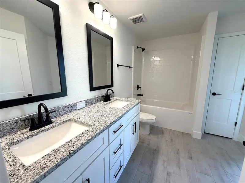 Furnished interior view inside a new home in Deep Creek, Punta Gorda (Image 6).