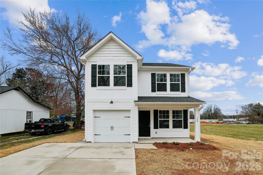 Front exterior of a new home in , Statesville, NC, highlighting curb appeal (Image 1). Front exterior of a new home in , Statesville, NC, highlighting curb appeal (Image 1).