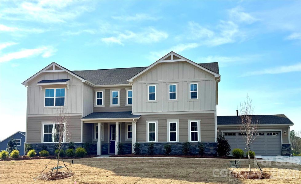 Front exterior of a new home in Blair Place, Monroe, NC, highlighting curb appeal (Image 22).