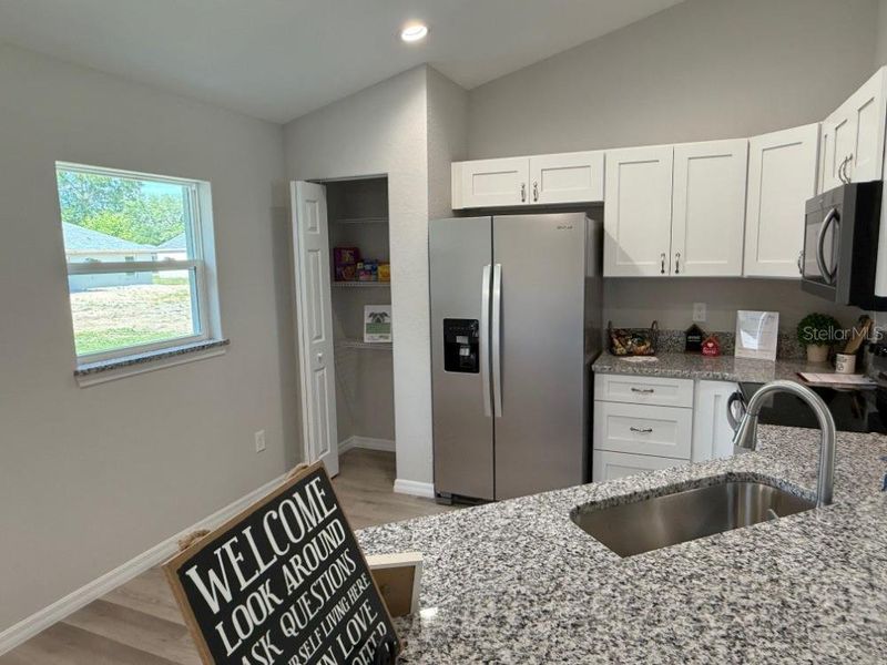 Furnished interior view inside a new home in , Dunnellon (Image 8).