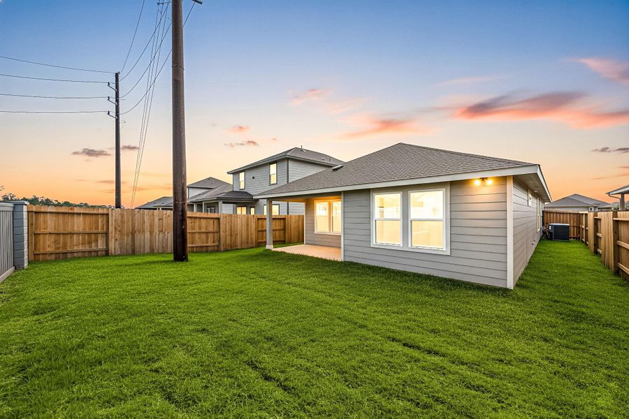 Enjoy evenings in your spacious backyard with a covered patio, perfect for outdoor dining or relaxing as the sun sets. The fully fenced yard offers privacy and plenty of room to play, garden, or unwind.