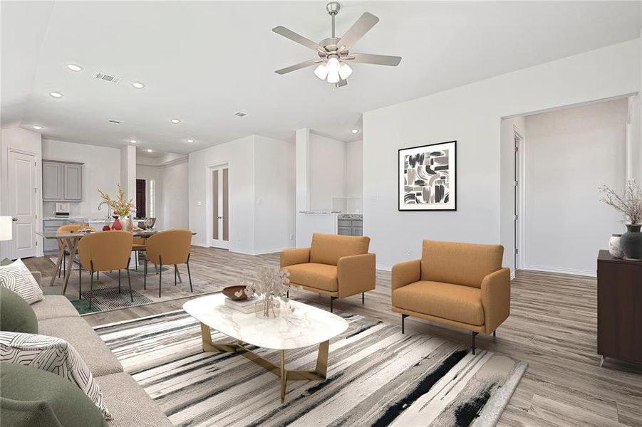 Living room with light hardwood / wood-style flooring and ceiling fan