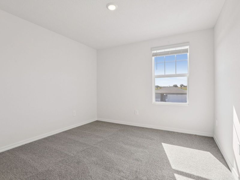 Spacious, unfurnished interior of a new home in The Grove at Stuart Crossing - Classic Series, Bartow (Image 19).