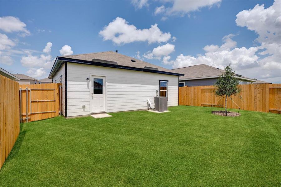 Rear view of property with a fenced backyard Rear view of property with a fenced backyard