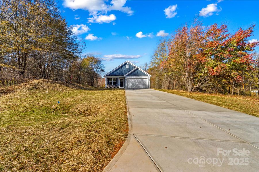 Front exterior of a new home in , Statesville, NC, highlighting curb appeal (Image 1). Front exterior of a new home in , Statesville, NC, highlighting curb appeal (Image 1).