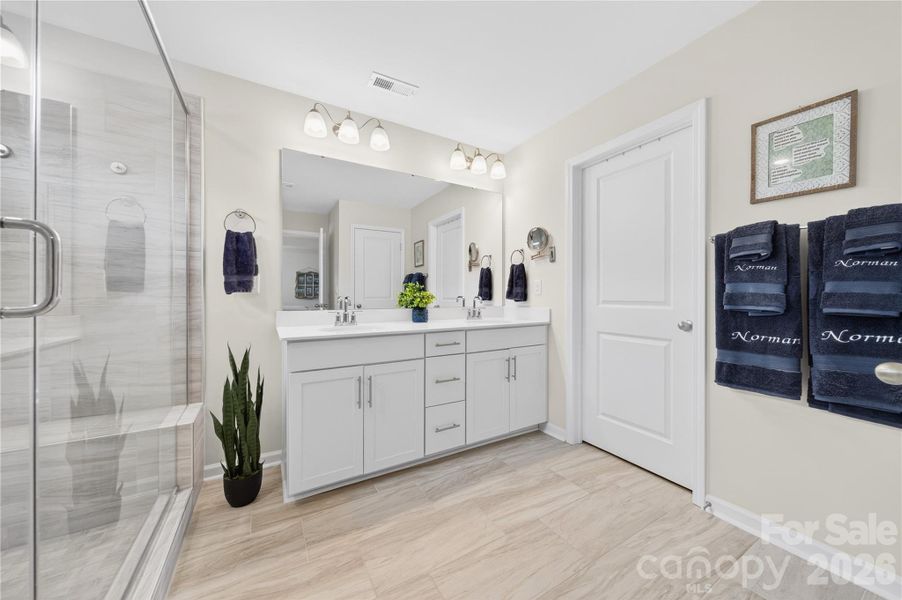 The primary ensuite has a spa like feel.