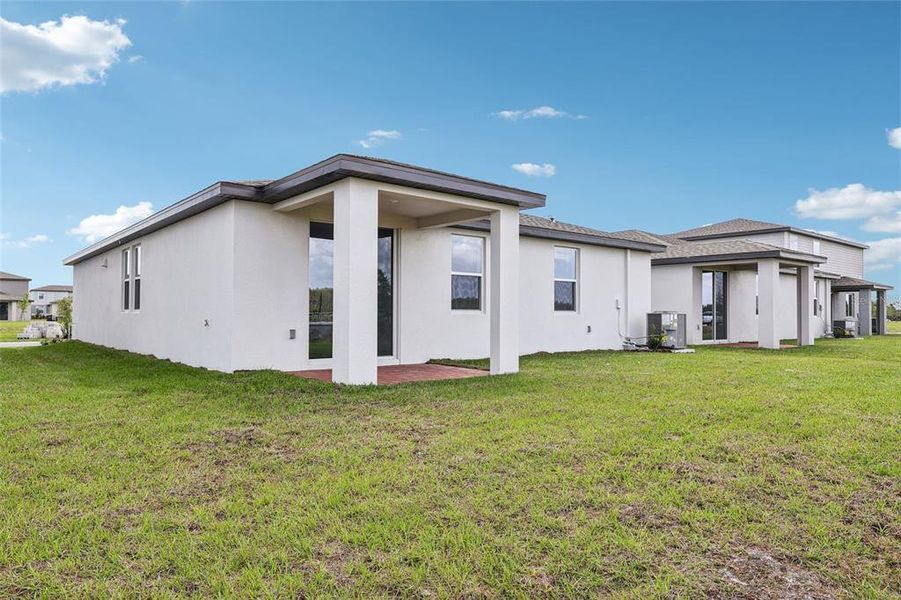 Exterior details and patio area of a home in The Meadow at Crossprairie, St. Cloud (Image 3). Exterior details and patio area of a home in The Meadow at Crossprairie, St. Cloud (Image 3).