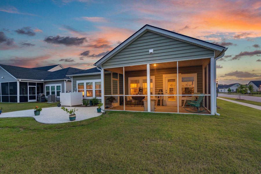 Front exterior of a new home in Horizons at Summers Corner | 55+: The Legends, Summerville, SC, highlighting curb appeal (Image 27).