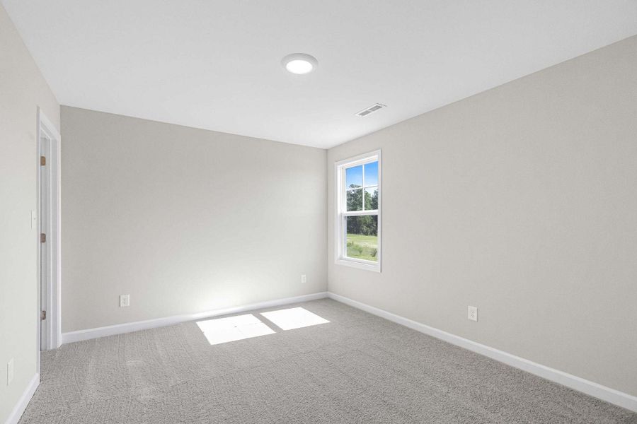 Representative unfurnished interior of a home built from the Magnolia by Caviness & Cates Communities in Bartlett Manor, Youngsville (Image 203).
