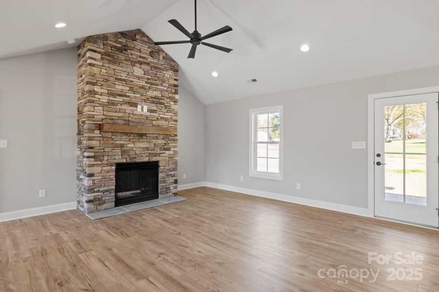 Cozy floor-to-ceiling stone fireplace with a warm wood mantel—perfect for curling up on a snowy day. Cozy floor-to-ceiling stone fireplace with a warm wood mantel—perfect for curling up on a snowy day.