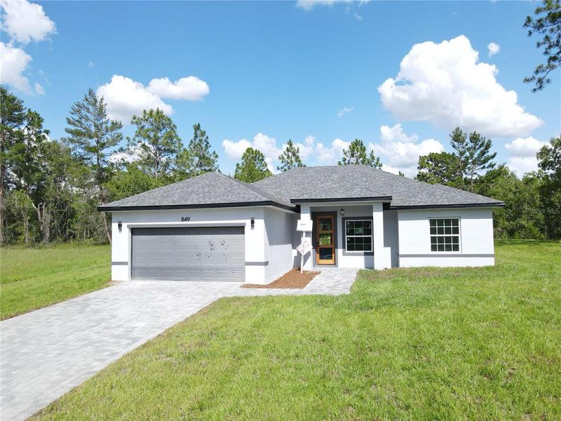 Front exterior of a new home in , Ocala, FL, highlighting curb appeal (Image 3).