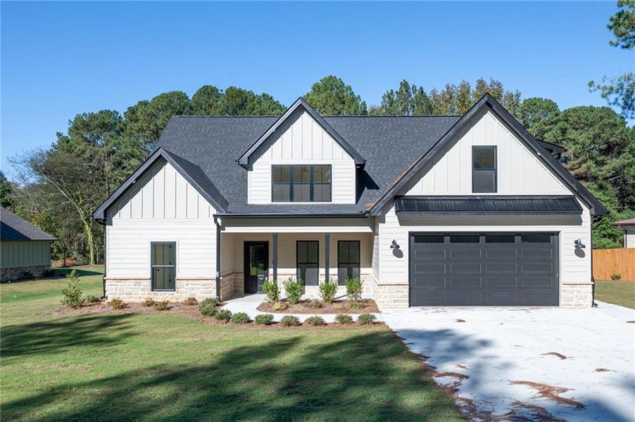 Front exterior of a new home in , Calhoun, GA, highlighting curb appeal (Image 2).