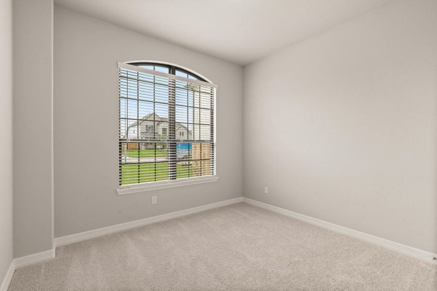 Secondary bedroom. Note: Sample product photo - actual exterior and interior selections may vary.