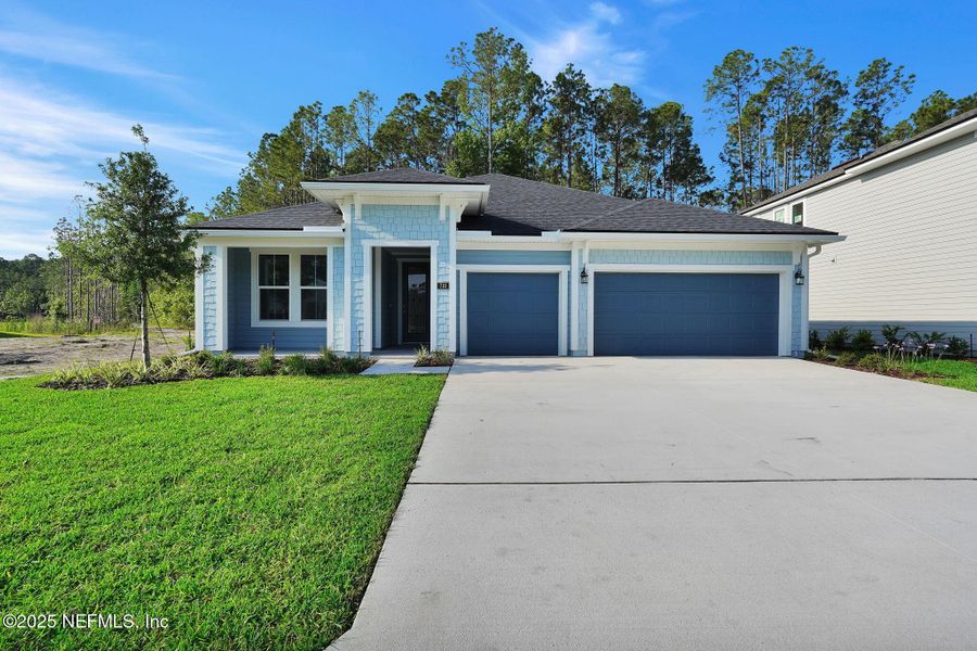 Front exterior of a new home in Trailmark - Phase 10, St. Augustine, FL, highlighting curb appeal (Image 21).