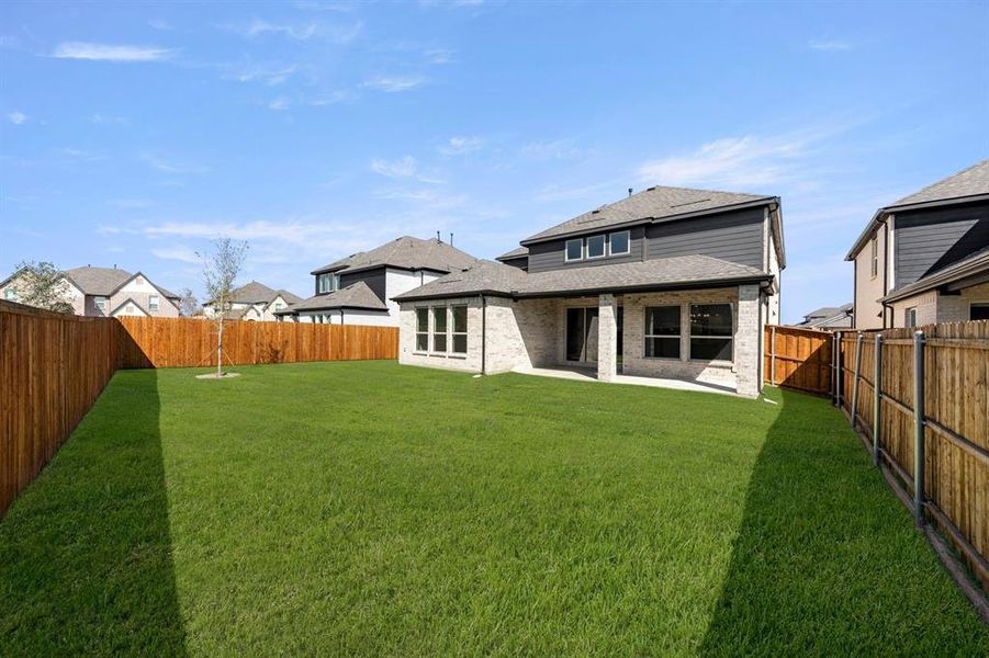 Exterior details and patio area of a home in Valencia on The Lake, Little Elm (Image 23).