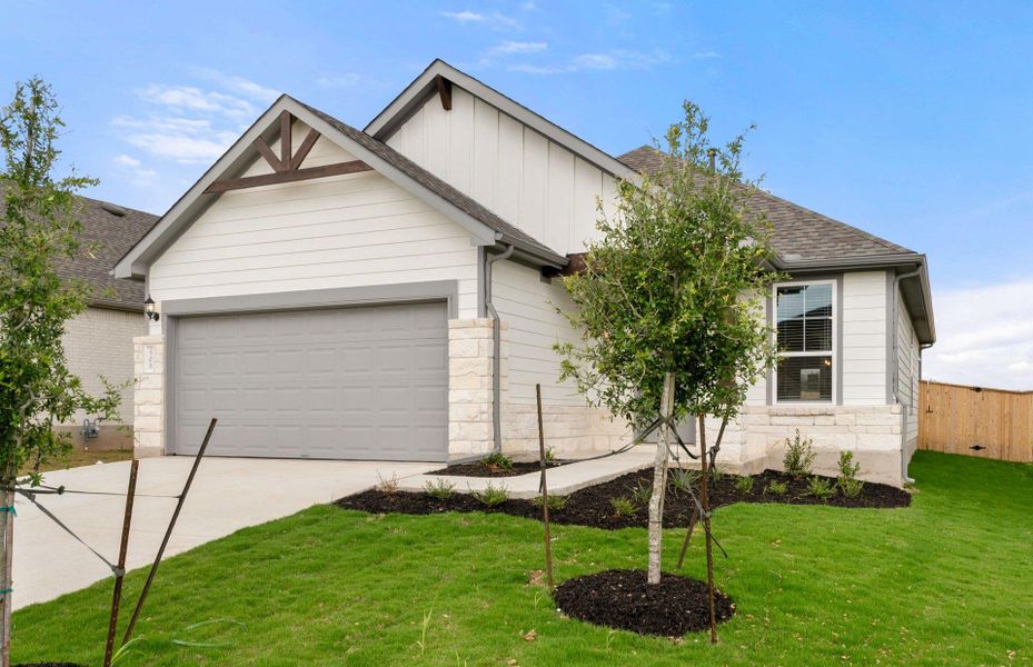 Front exterior of a new home in Patterson Ranch, Georgetown, TX, highlighting curb appeal (Image 29). Front exterior of a new home in Patterson Ranch, Georgetown, TX, highlighting curb appeal (Image 29).