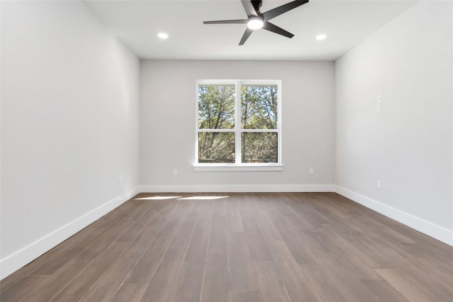 Primary bedroom facing back of home