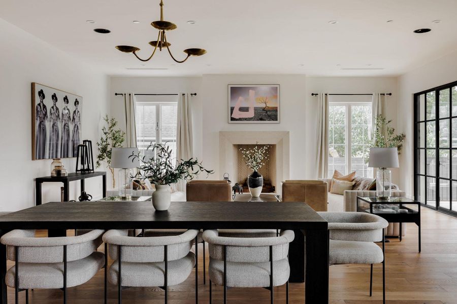 Defined by volume and light, the dining area balances intimacy with openness, framed by designer lighting and smooth transitions to the kitchen. Defined by volume and light, the dining area balances intimacy with openness, framed by designer lighting and smooth transitions to the kitchen.
