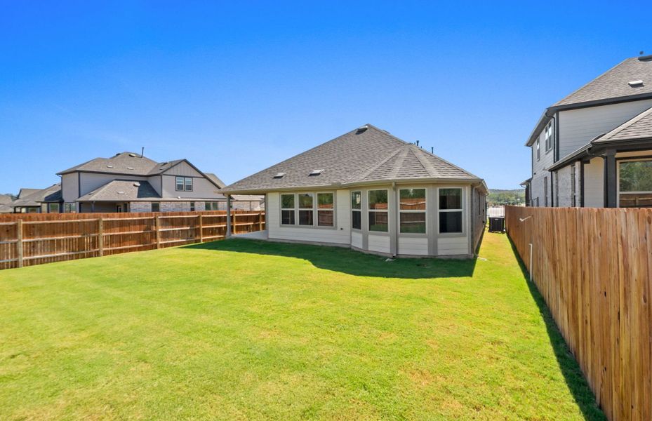 Exterior details and patio area of a home in Saddleback at Santa Rita Ranch, Liberty Hill (Image 21). Exterior details and patio area of a home in Saddleback at Santa Rita Ranch, Liberty Hill (Image 21).